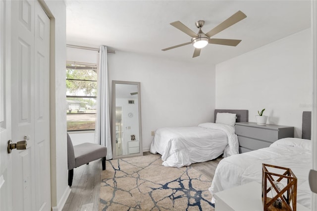 bedroom featuring light wood finished floors and ceiling fan