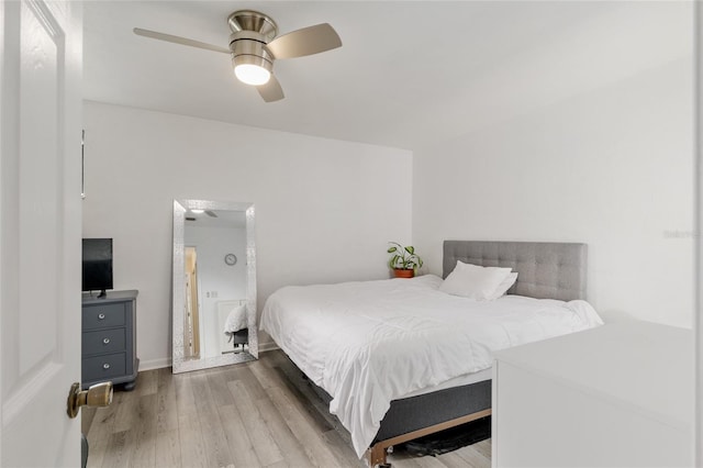 bedroom featuring wood finished floors and a ceiling fan