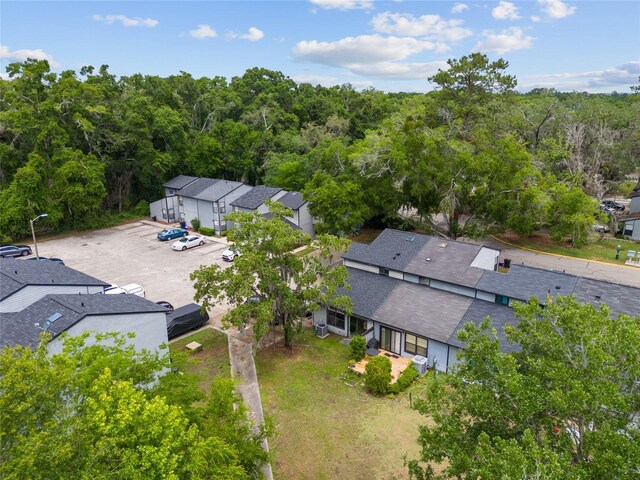 aerial perspective of suburban area featuring a forest