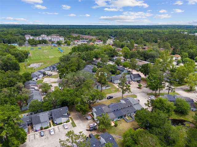 aerial view of residential area featuring a heavily wooded area