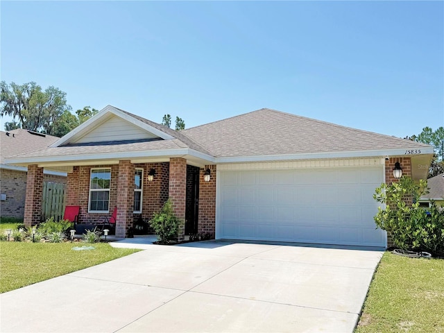15835 NW 123rd Ave, Alachua, FL 32615 - ranch-style house featuring brick siding, an attached garage, concrete driveway, a front yard, and roof with shingles