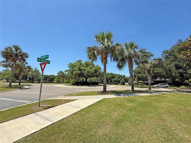 15835 NW 123rd Ave, Alachua, FL 32615 - view of asphalt road featuring traffic signs and sidewalks