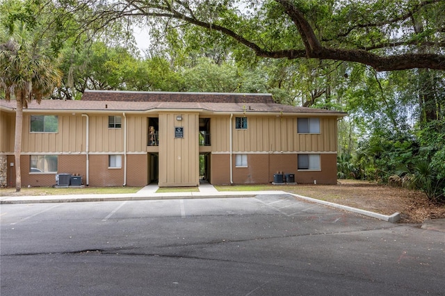507 NW 39th Rd Unit 235, Gainesville, FL 32607 - view of property featuring uncovered parking and central air condition unit