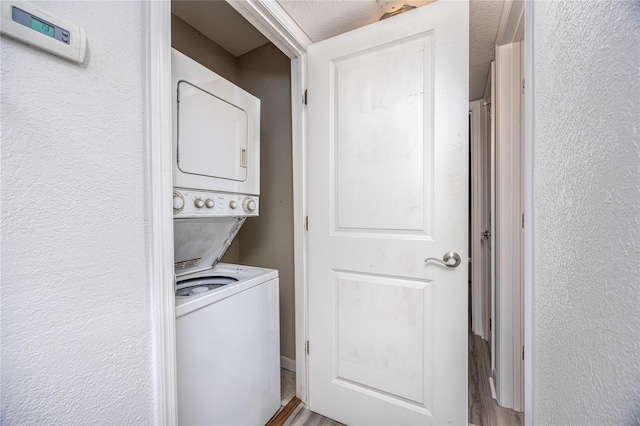 507 NW 39th Rd Unit 235, Gainesville, FL 32607 - clothes washing area with estacked washer and dryer