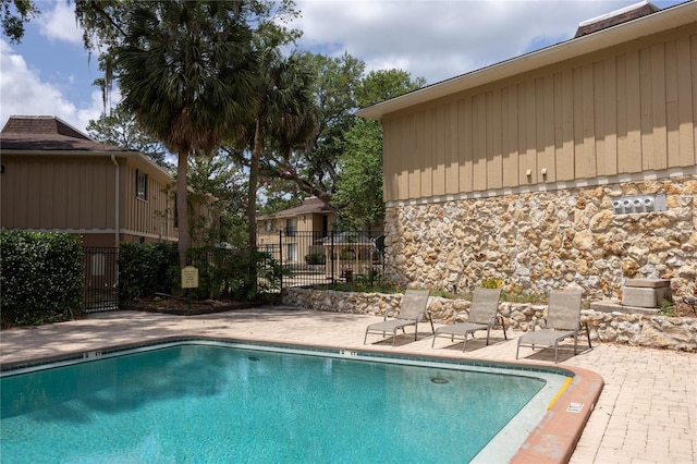 507 NW 39th Rd Unit 235, Gainesville, FL 32607 - community pool with fence and a patio area
