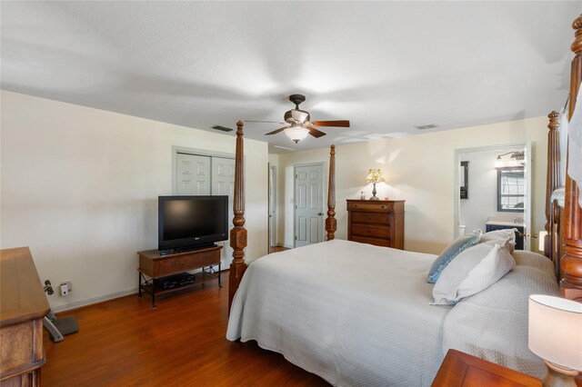 7450 SE State Road 121, Morriston, FL 32668 - bedroom featuring wood finished floors, baseboards, a ceiling fan, and ensuite bath