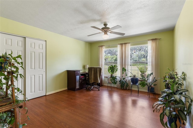 7450 SE State Road 121, Morriston, FL 32668 - home office with wood finished floors, a ceiling fan, a textured ceiling, and baseboards