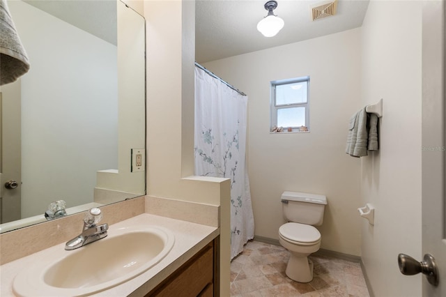 7450 SE State Road 121, Morriston, FL 32668 - bathroom with toilet, vanity, baseboards, and stone finish floors