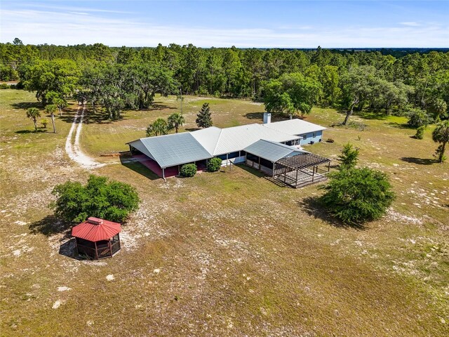 7450 SE State Road 121, Morriston, FL 32668 - overview of rural landscape with a heavily wooded area
