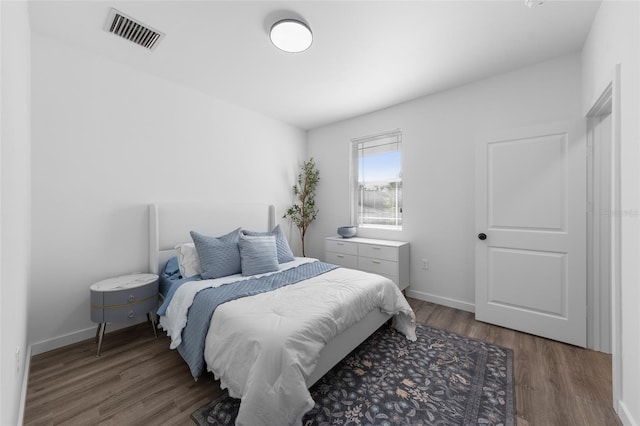 1601 NW 29th Rd Unit 2, Gainesville, FL 32605 - bedroom featuring wood finished floors and baseboards