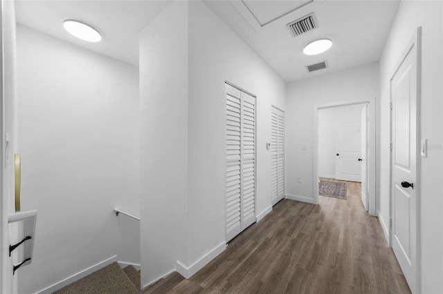 1601 NW 29th Rd Unit 2, Gainesville, FL 32605 - hall featuring an upstairs landing, wood finished floors, and baseboards