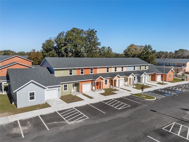 1601 NW 29th Rd Unit 2, Gainesville, FL 32605 - view of front facade featuring uncovered parking, roof with shingles, and a residential view