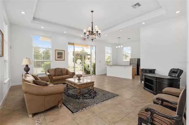 1601 NW 29th Rd Unit 2, Gainesville, FL 32605 - living room with recessed lighting, a tray ceiling, a chandelier, baseboards, and light tile patterned flooring