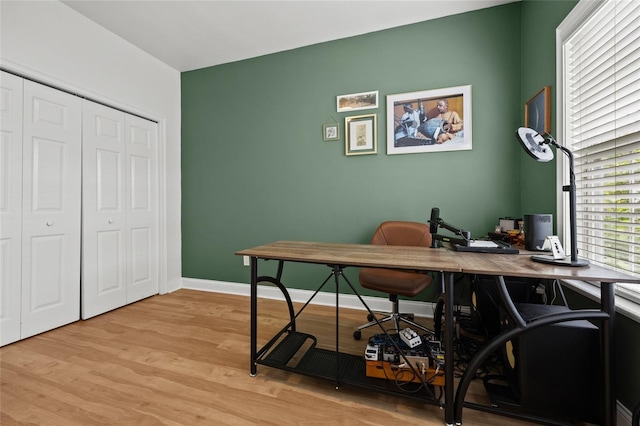 office featuring light wood-style floors and baseboards