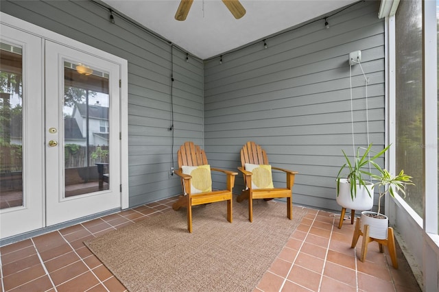 sunroom / solarium featuring french doors, ceiling fan, and track lighting