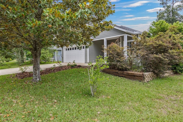 7485 NW 121st Ave, Alachua, FL 32615 - obstructed view of property featuring driveway, a front lawn, and a garage