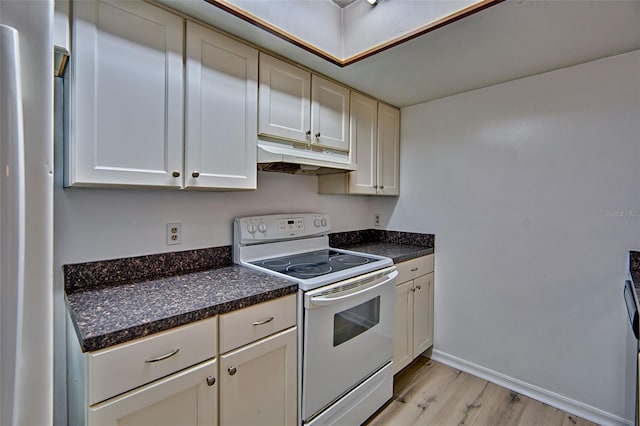 kitchen featuring white electric stove, under cabinet range hood, light wood finished floors, and dark countertops