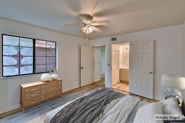 bedroom with light wood-type flooring, baseboards, connected bathroom, and a ceiling fan