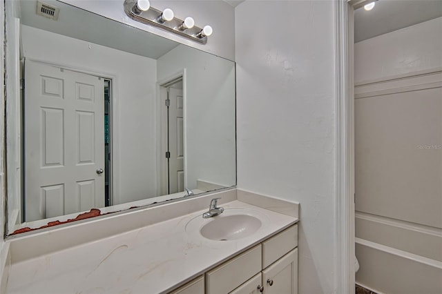 full bathroom featuring vanity and a tub to relax in