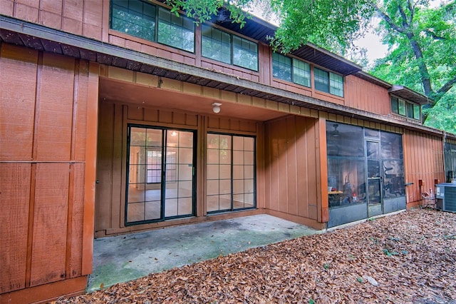 doorway to property with central AC unit