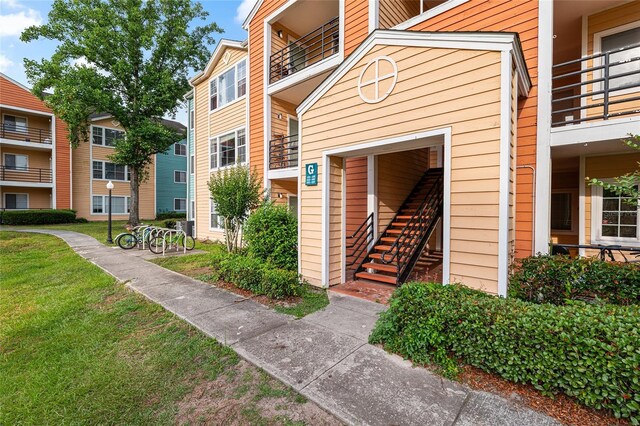 2601 SW Archer Rd Unit G 128, Gainesville, FL 32608 - entrance to property featuring a yard and a balcony