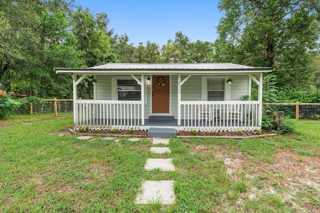 2529 SE 11th Ave, Gainesville, FL 32641 - bungalow-style home with a porch and metal roof