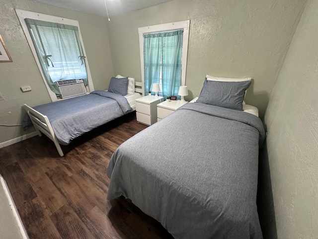 2529 SE 11th Ave, Gainesville, FL 32641 - bedroom featuring a textured wall, dark wood finished floors, cooling unit, and baseboards