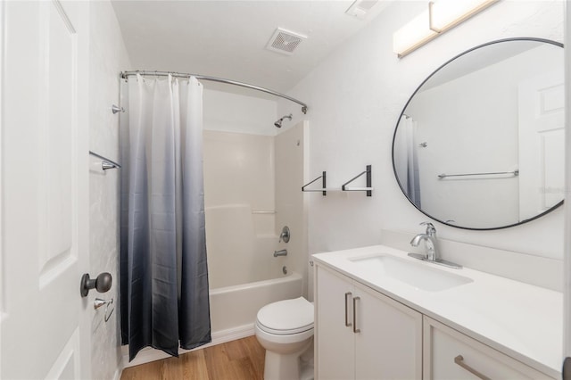 4415 SW 34th St Unit 503, Gainesville, FL 32608 - bathroom with wood finished floors, vanity, shower / tub combo with curtain, and toilet
