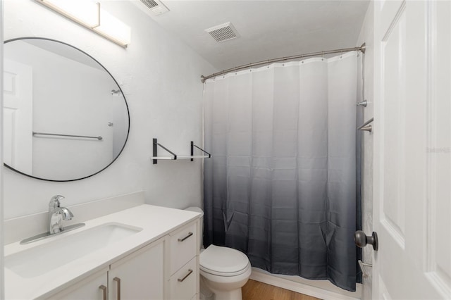 4415 SW 34th St Unit 503, Gainesville, FL 32608 - bathroom featuring toilet, vanity, and curtained shower