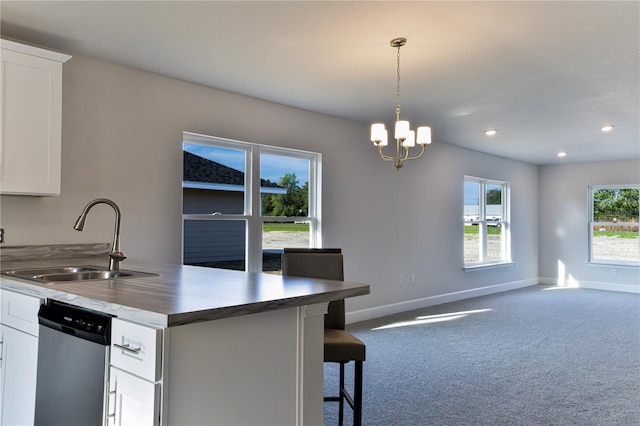 1926 N Roberts Trl, Bell, FL 32619 - kitchen with a sink, stainless steel dishwasher, baseboards, dark carpet, and a peninsula