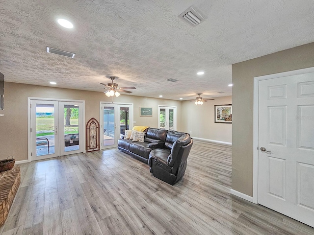 7972 State Rd Unit 100, Keystone Heights, FL 32656 - living room featuring baseboards, ceiling fan, a textured ceiling, and recessed lighting