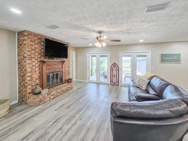 7972 State Rd Unit 100, Keystone Heights, FL 32656 - living area featuring ceiling fan, light wood-type flooring, french doors, a textured ceiling, and recessed lighting