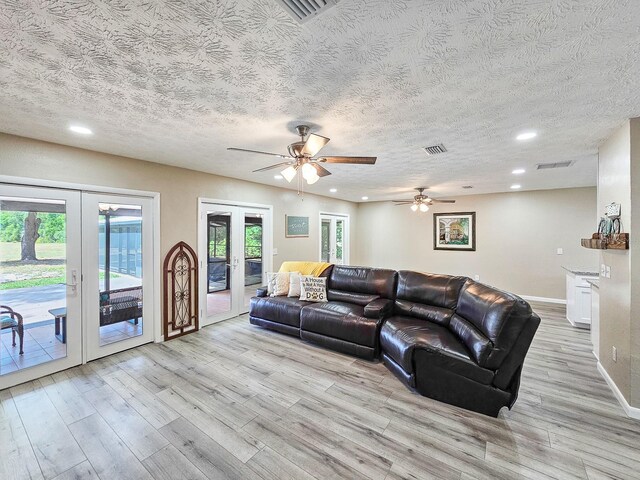 7972 State Rd Unit 100, Keystone Heights, FL 32656 - living area featuring french doors, light wood-style floors, recessed lighting, baseboards, and a ceiling fan