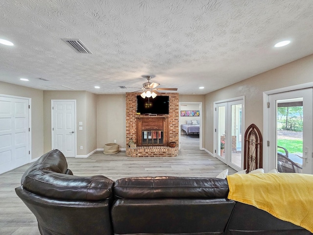 7972 State Rd Unit 100, Keystone Heights, FL 32656 - living room featuring a ceiling fan, wood finished floors, baseboards, a fireplace, and recessed lighting