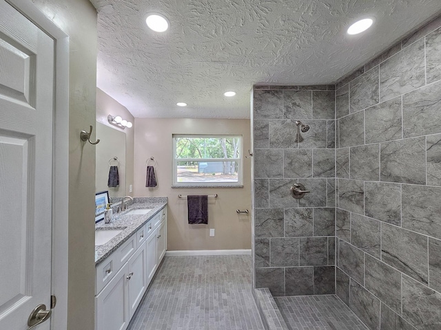 7972 State Rd Unit 100, Keystone Heights, FL 32656 - full bath with baseboards, recessed lighting, tiled shower, double vanity, and a textured ceiling
