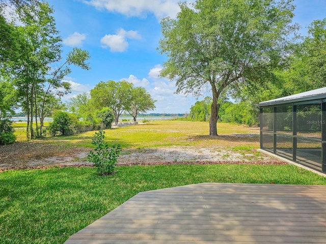 7972 State Rd Unit 100, Keystone Heights, FL 32656 - view of green lawn with a wooden deck