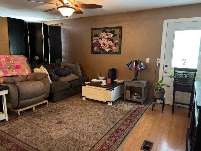 6410 SW 170th St, Archer, FL 32618 - living area with a ceiling fan and light wood-type flooring