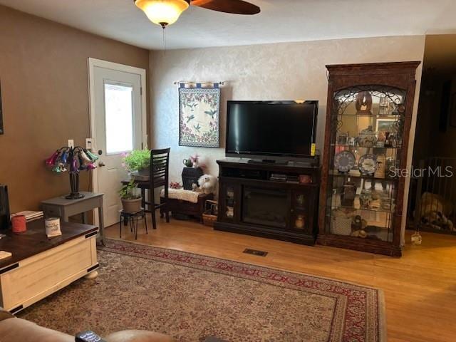 6410 SW 170th St, Archer, FL 32618 - living room with wood finished floors and ceiling fan