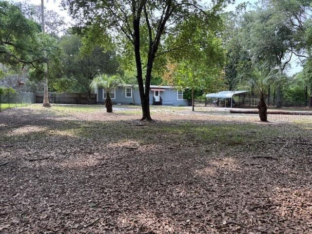 6410 SW 170th St, Archer, FL 32618 - view of yard with fence and a carport