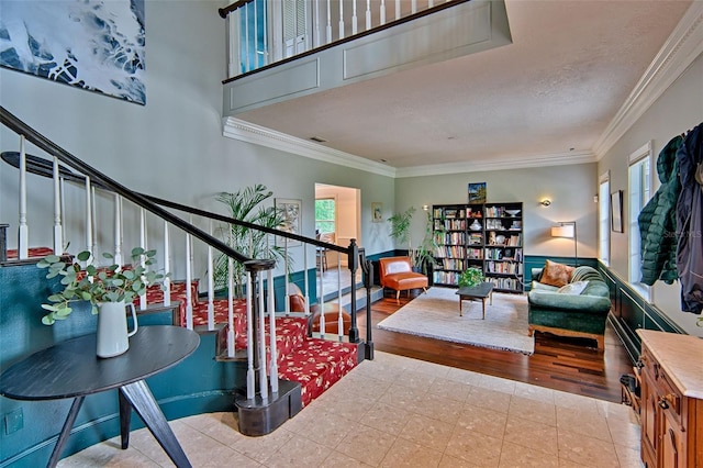 20250 NW 71st Ct, Micanopy, FL 32667 - living room with stairway, ornamental molding, tile patterned floors, and a textured ceiling