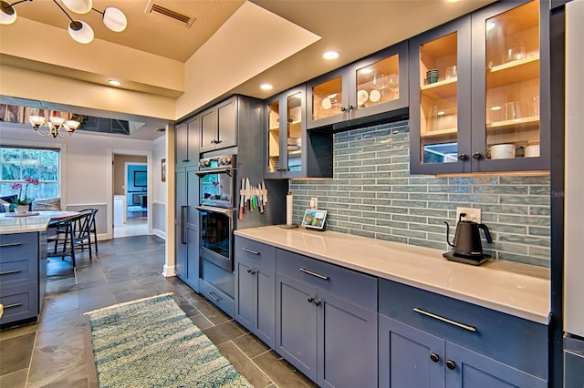 20250 NW 71st Ct, Micanopy, FL 32667 - kitchen featuring tasteful backsplash, double oven, light countertops, a chandelier, and recessed lighting