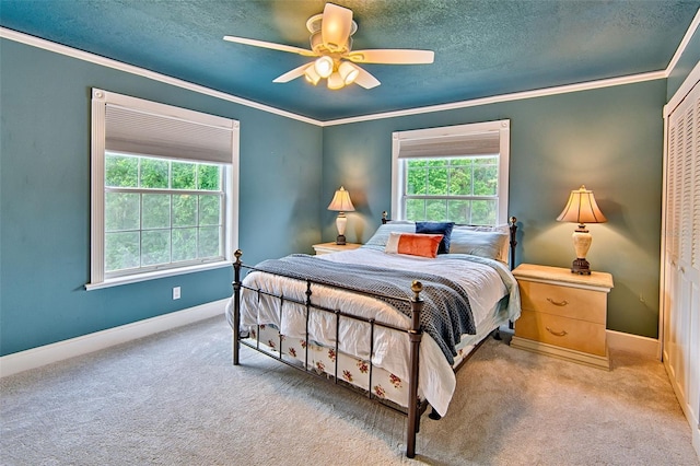 20250 NW 71st Ct, Micanopy, FL 32667 - carpeted bedroom with multiple windows, ornamental molding, baseboards, a textured ceiling, and a ceiling fan