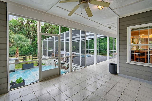 20250 NW 71st Ct, Micanopy, FL 32667 - unfurnished sunroom featuring a ceiling fan and healthy amount of natural light