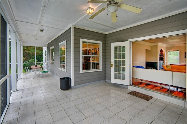 20250 NW 71st Ct, Micanopy, FL 32667 - unfurnished sunroom featuring a ceiling fan