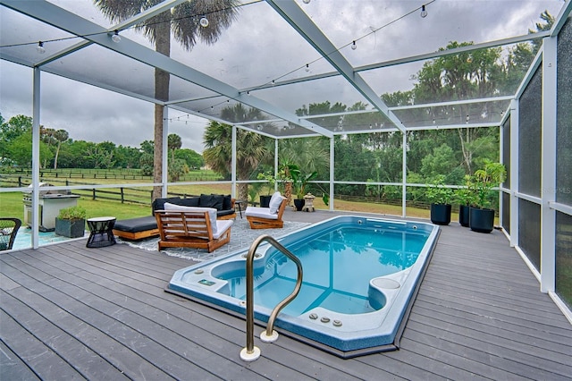 20250 NW 71st Ct, Micanopy, FL 32667 - swimming pool featuring an outdoor living space, a wooden deck, and a lanai