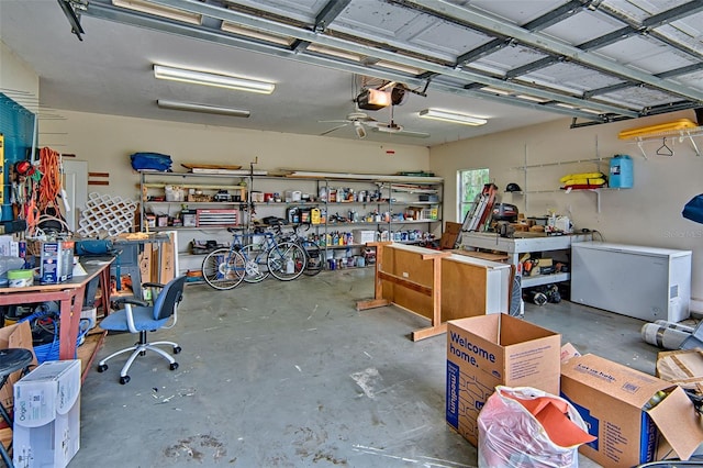 20250 NW 71st Ct, Micanopy, FL 32667 - garage with a workshop area, fridge, ceiling fan, and a garage door opener