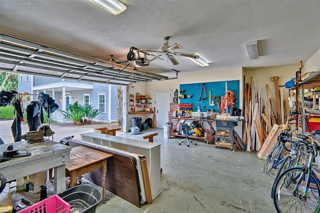 20250 NW 71st Ct, Micanopy, FL 32667 - garage featuring a workshop area, ceiling fan, and a garage door opener