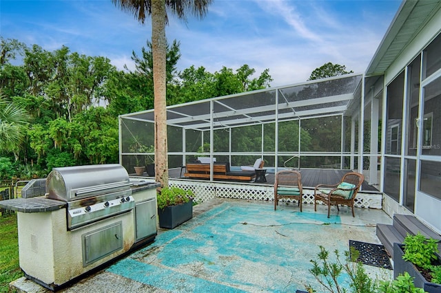 20250 NW 71st Ct, Micanopy, FL 32667 - view of patio / terrace with a grill, a lanai, and an outdoor kitchen