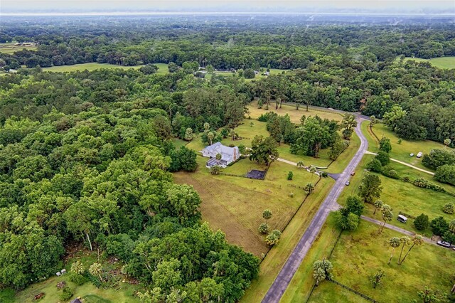 20250 NW 71st Ct, Micanopy, FL 32667 - aerial view of property and surrounding area with rural landscape and a forest