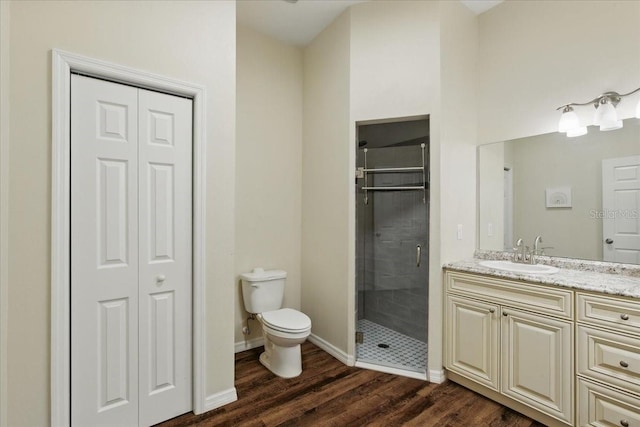 1180 Hough St, Bell, FL 32619 - full bath with wood finished floors, toilet, a stall shower, and a closet